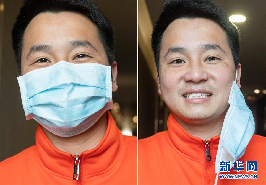 우한시 우창(武昌) 거주지에서 장시 의료팀 팀원인 류신(劉鑫)이 마스크를 벗은 채 미소를 짓고 있다. [사진 출처: 신화망]