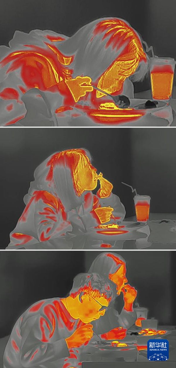 암흑식당에서 식사하는 식사객들의 모습을 열화상 카메라로 촬영한 사진 [2023년 12월 24일 촬영/사진 출처: 신화사]